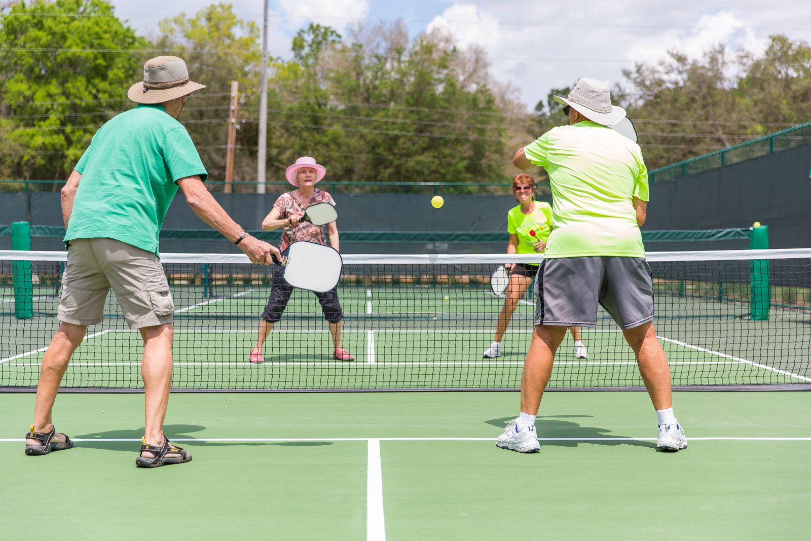 Recreational pickleball doubles mid-rally